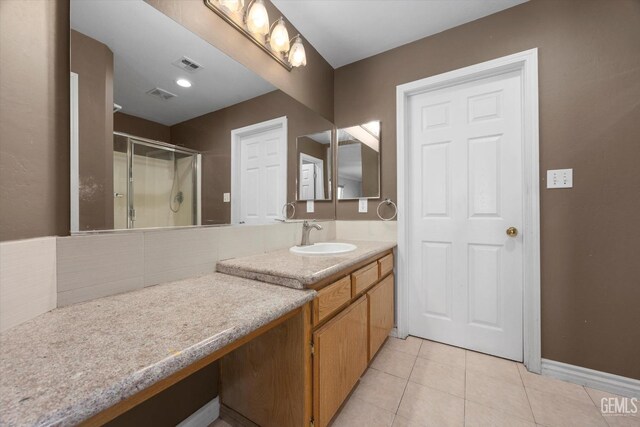 4312 Rio Viejo Dr, Bakersfield, CA 93313 - bathroom featuring visible vents, vanity, a stall shower, and tile patterned floors