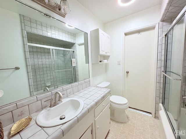 2711 Hubbard St, Bakersfield, CA 93301 - full bathroom featuring toilet, vanity, and tile patterned flooring