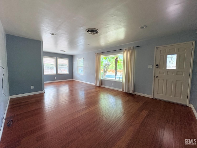 2711 Hubbard St, Bakersfield, CA 93301 - unfurnished living room with wood finished floors and baseboards