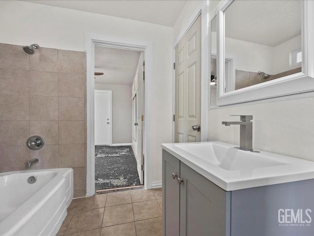 801 Fillmore St, Taft, CA 93268 - bathroom with vanity, tile patterned flooring, shower / bath combination, and a textured ceiling