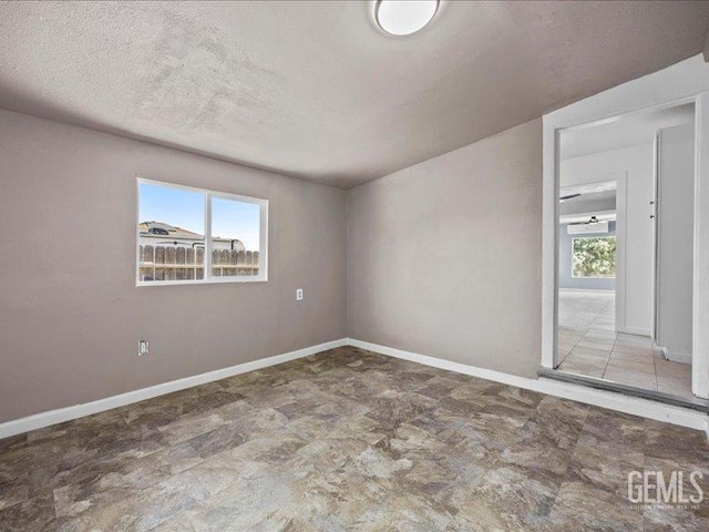 801 Fillmore St, Taft, CA 93268 - empty room featuring a textured ceiling and baseboards