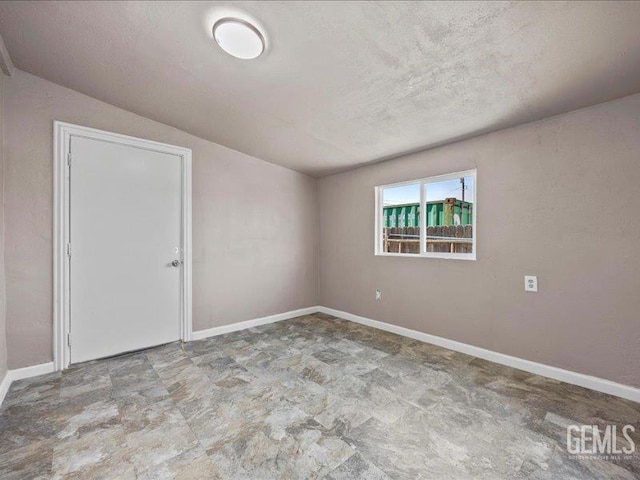 801 Fillmore St, Taft, CA 93268 - empty room with a textured ceiling