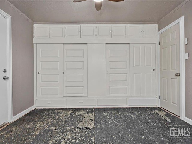 801 Fillmore St, Taft, CA 93268 - unfurnished bedroom featuring ornamental molding, a closet, and a ceiling fan