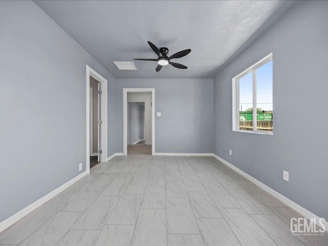 801 Fillmore St, Taft, CA 93268 - empty room with a textured ceiling and a ceiling fan