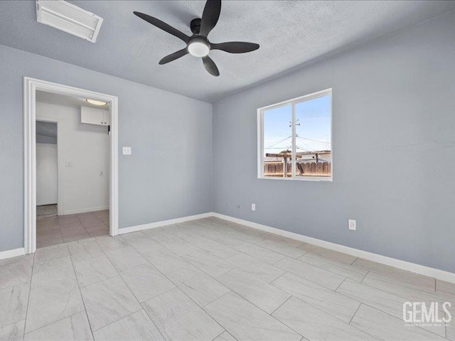 801 Fillmore St, Taft, CA 93268 - empty room featuring a textured ceiling and ceiling fan