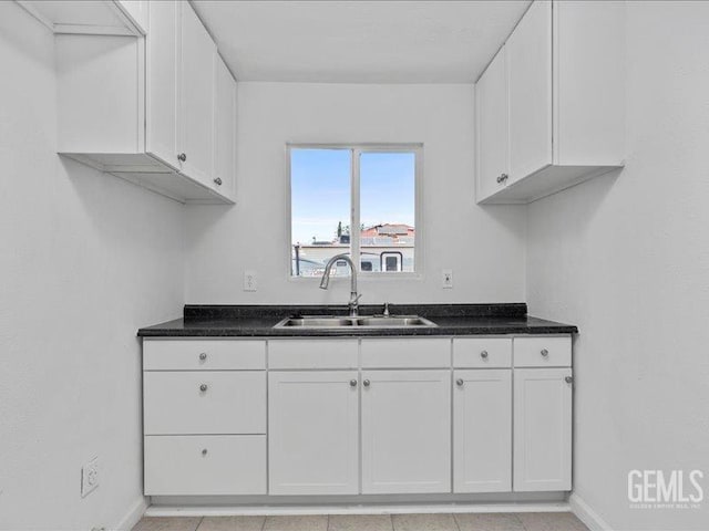 801 Fillmore St, Taft, CA 93268 - kitchen featuring white cabinetry