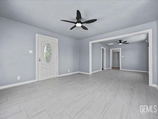 801 Fillmore St, Taft, CA 93268 - unfurnished living room with a ceiling fan and a textured ceiling