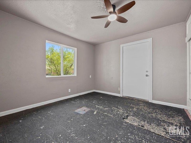 801 Fillmore St, Taft, CA 93268 - spare room featuring a ceiling fan and a textured ceiling