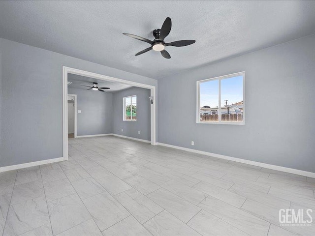 801 Fillmore St, Taft, CA 93268 - unfurnished room featuring a ceiling fan and a textured ceiling