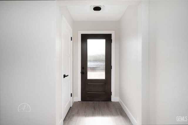 doorway with light wood-type flooring