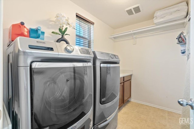 16018 La Strada Ct, Bakersfield, CA 93314 - washroom with separate washer and dryer and cabinet space