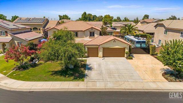 16018 La Strada Ct, Bakersfield, CA 93314 - mediterranean / spanish-style home with a residential view, an attached garage, a tile roof, stucco siding, and concrete driveway