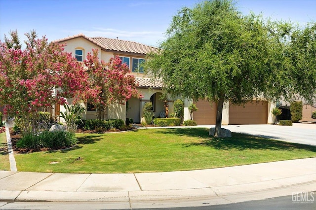 16018 La Strada Ct, Bakersfield, CA 93314 - mediterranean / spanish home with a tiled roof, concrete driveway, stucco siding, and a front yard