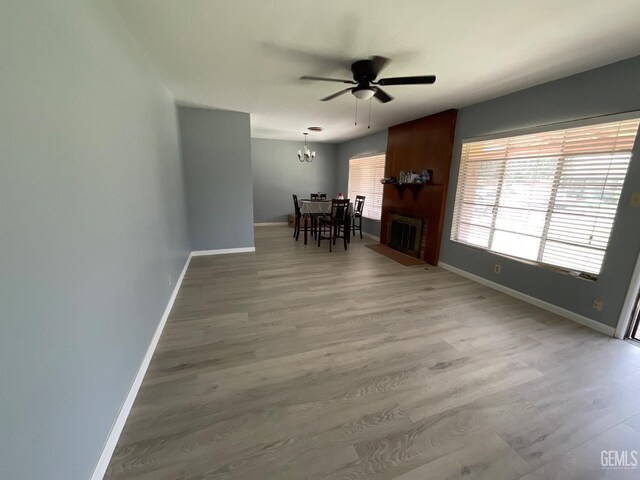 3914 Apache Ave, Bakersfield, CA 93309 - living area with ceiling fan, wood finished floors, and a chandelier