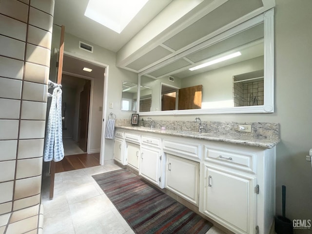 2204 Tilden Way, Bakersfield, CA 93309 - full bathroom featuring double vanity and tile patterned floors