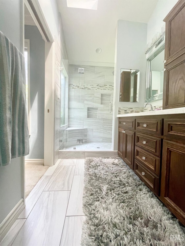 2204 Tilden Way, Bakersfield, CA 93309 - full bathroom with baseboards, vanity, a stall shower, and marble finish floors