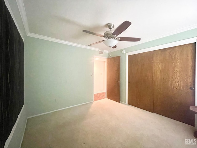 2204 Tilden Way, Bakersfield, CA 93309 - unfurnished bedroom with carpet, crown molding, a closet, ceiling fan, and baseboards