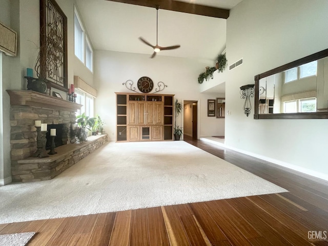 2204 Tilden Way, Bakersfield, CA 93309 - unfurnished living room with high vaulted ceiling, plenty of natural light, a fireplace, a ceiling fan, and wood finished floors