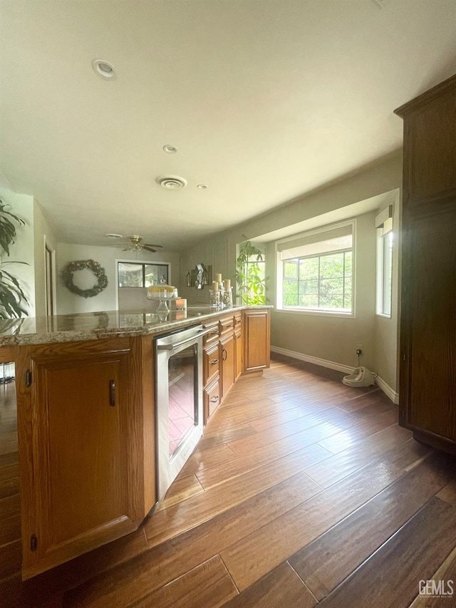 2204 Tilden Way, Bakersfield, CA 93309 - kitchen featuring beverage cooler, light wood-style flooring, baseboards, a ceiling fan, and recessed lighting