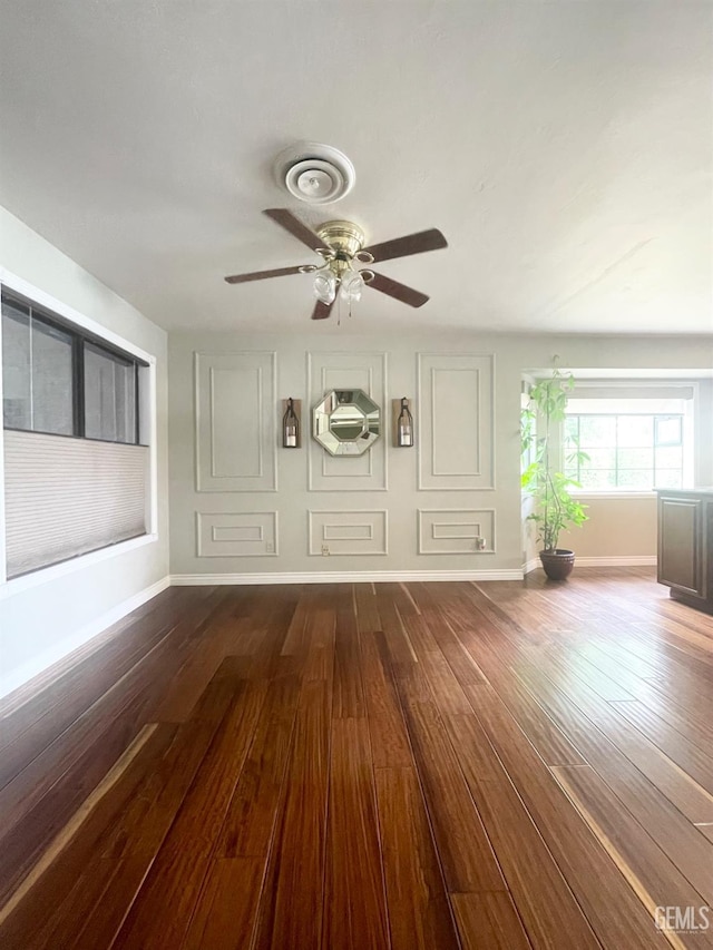 2204 Tilden Way, Bakersfield, CA 93309 - unfurnished living room featuring dark wood-type flooring, a ceiling fan, and baseboards