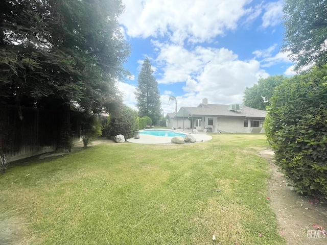 2204 Tilden Way, Bakersfield, CA 93309 - view of grassy yard featuring an outdoor pool