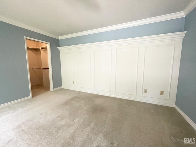 2204 Tilden Way, Bakersfield, CA 93309 - unfurnished bedroom with crown molding, light carpet, baseboards, and a spacious closet