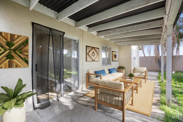 view of patio with fence and an outdoor living space