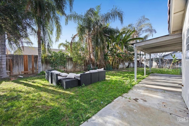 view of yard featuring a patio area, a fenced backyard, and an outdoor hangout area