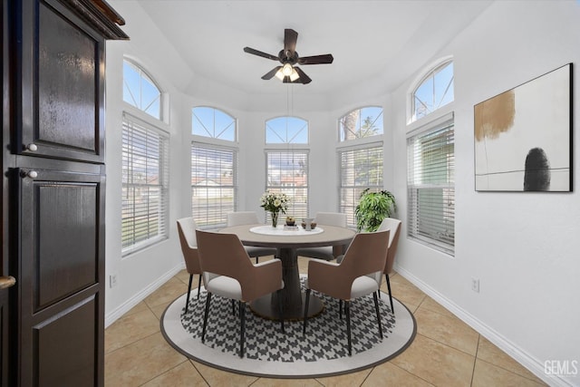 dining room with light tile patterned floors and baseboards