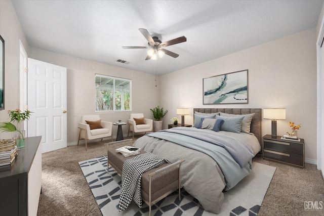 bedroom with a ceiling fan, baseboards, visible vents, and carpet flooring