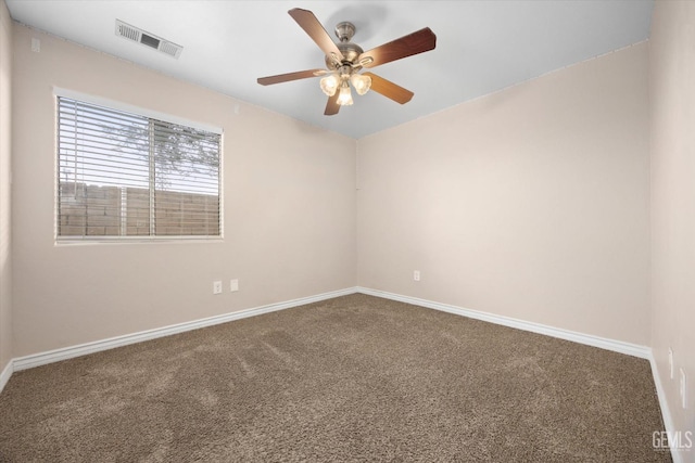 unfurnished room with a ceiling fan, carpet, visible vents, and baseboards