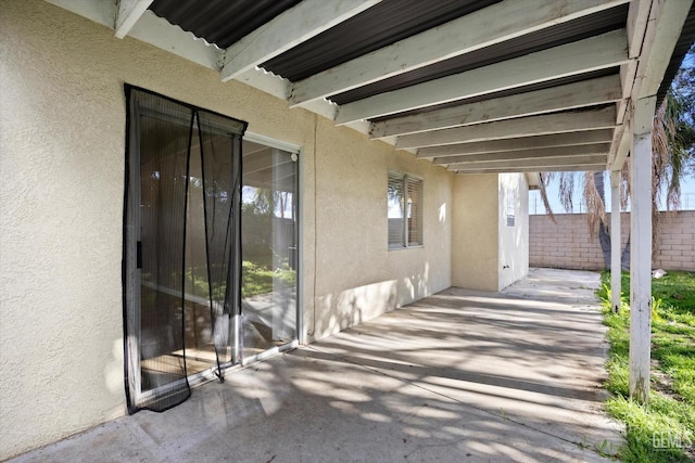 view of patio featuring fence