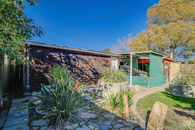 rear view of property with fence