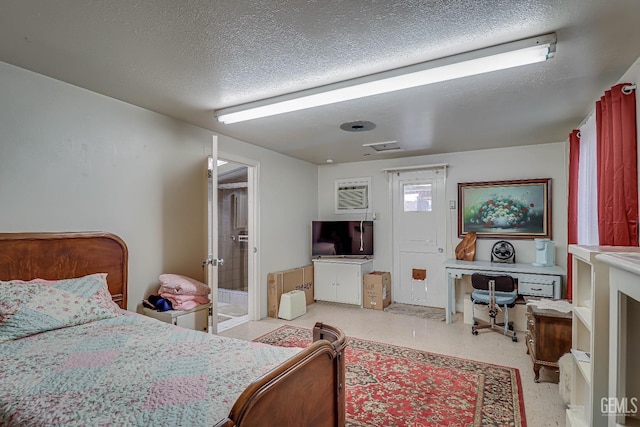 bedroom with french doors and a textured ceiling