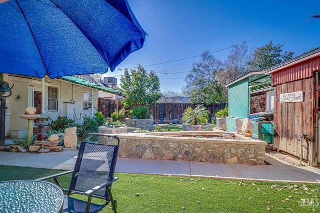 view of yard with a patio and fence