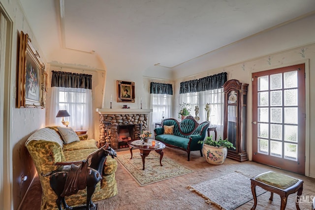 living room featuring carpet flooring and a fireplace