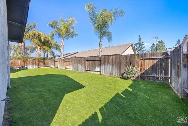 view of yard featuring a fenced backyard