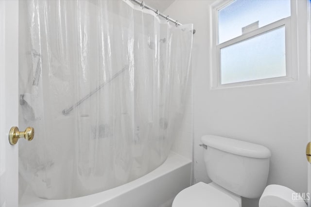 full bath with toilet and shower / tub combo with curtain