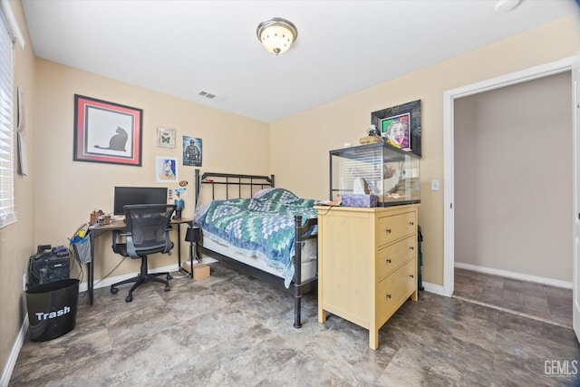 bedroom featuring visible vents and baseboards