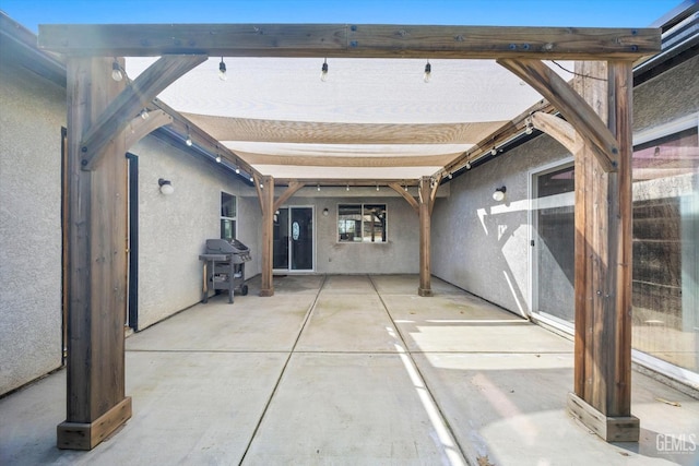 view of patio with a grill