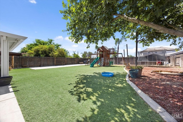 5437 White Wheat Ave, Bakersfield, CA 93313 - view of yard featuring a trampoline and a playground