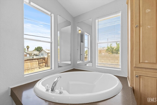 bathroom featuring a tub