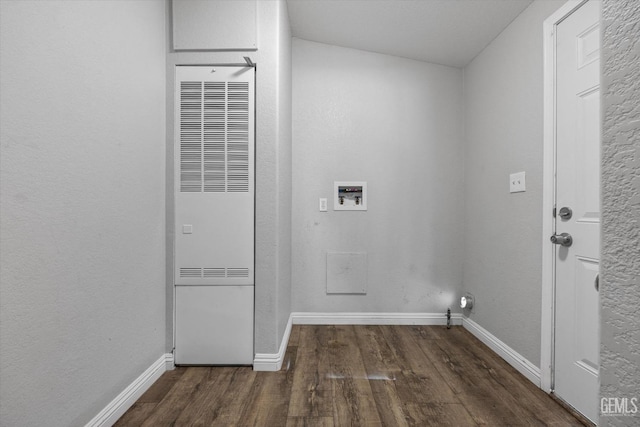 washroom featuring washer hookup and dark hardwood / wood-style flooring