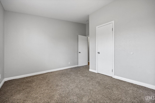 spare room featuring carpet floors