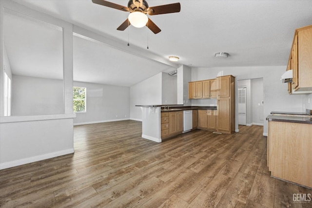 kitchen with sink, dishwasher, vaulted ceiling with beams, dark hardwood / wood-style floors, and kitchen peninsula