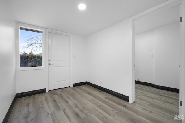 spare room featuring light hardwood / wood-style floors