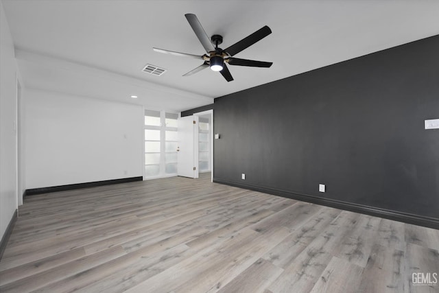 unfurnished room with light hardwood / wood-style flooring and ceiling fan