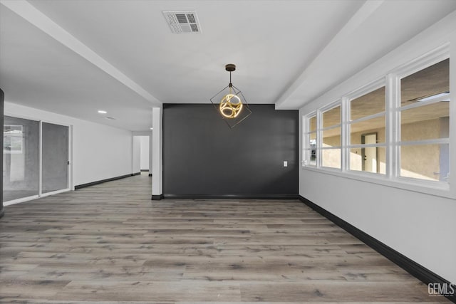 unfurnished dining area with hardwood / wood-style flooring