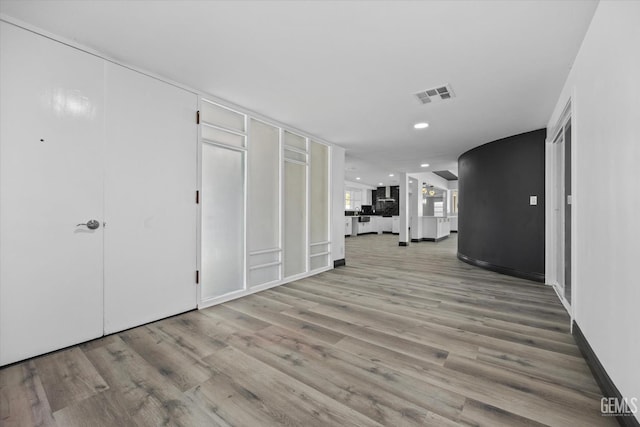 hall with light wood-type flooring