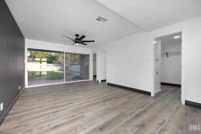 interior space with light hardwood / wood-style floors and ceiling fan